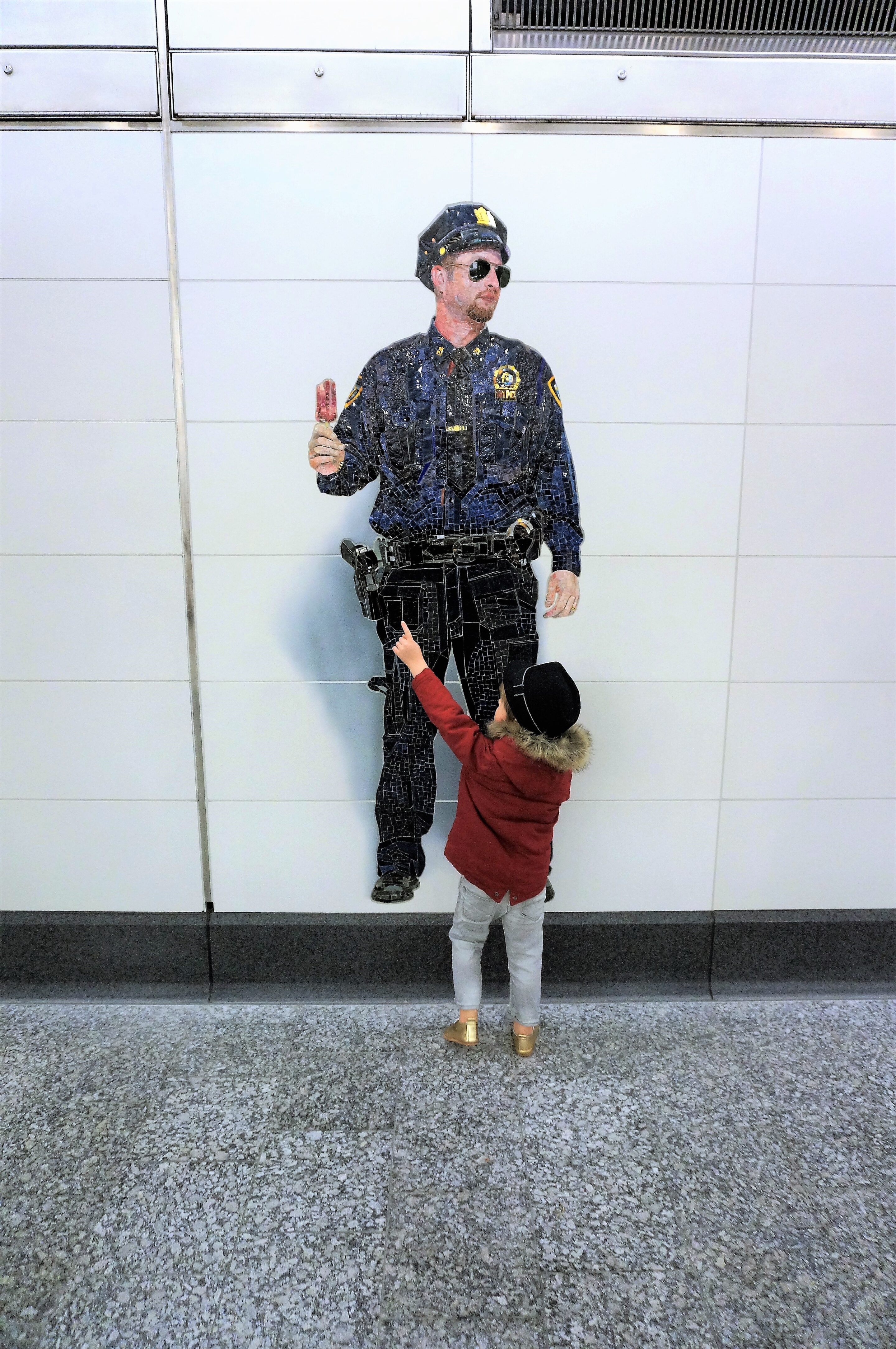 Police Officer art in Second Ave Subway by Vik Muniz