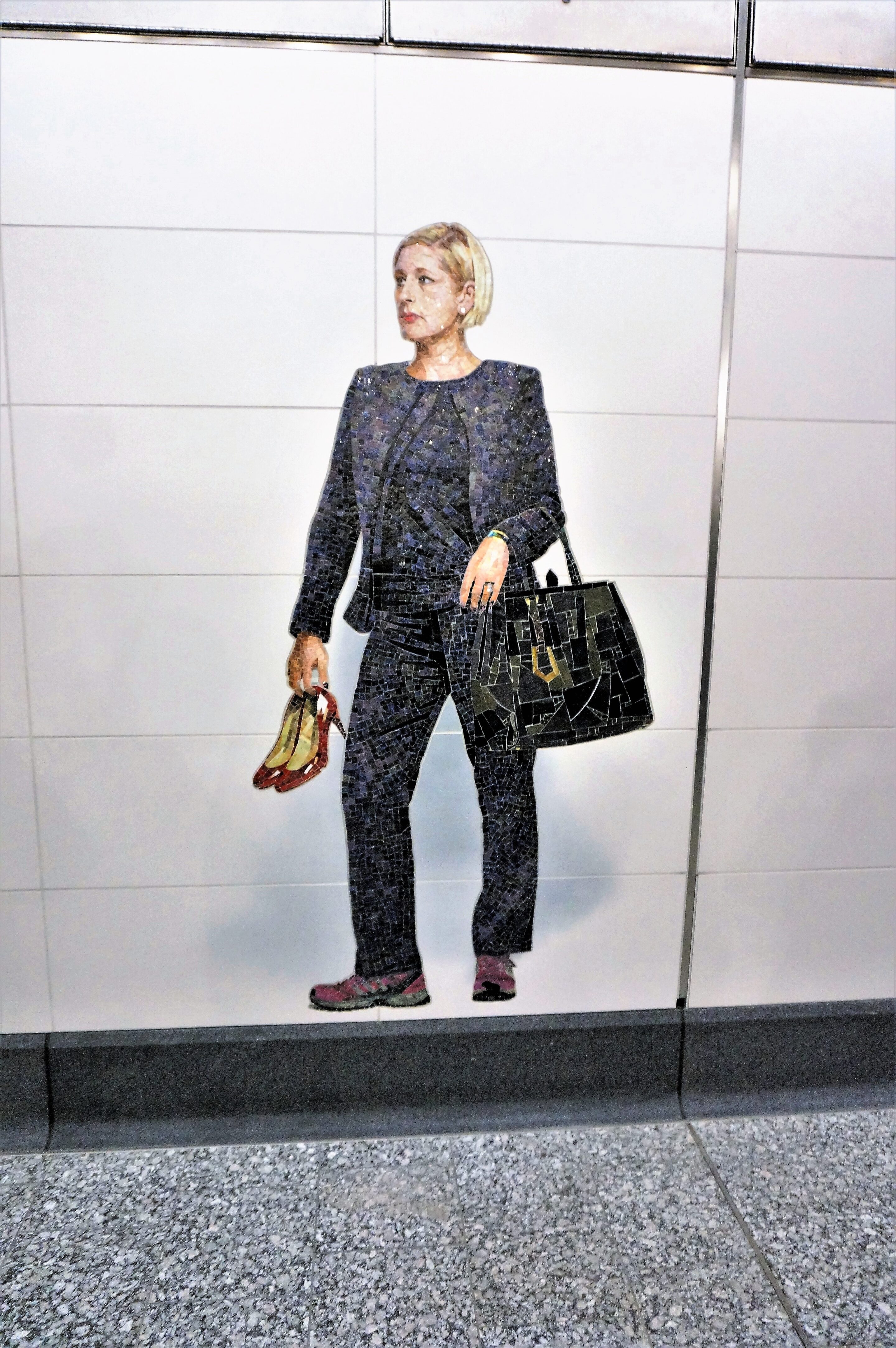 Woman holding shoes mural in Second Ave Subway