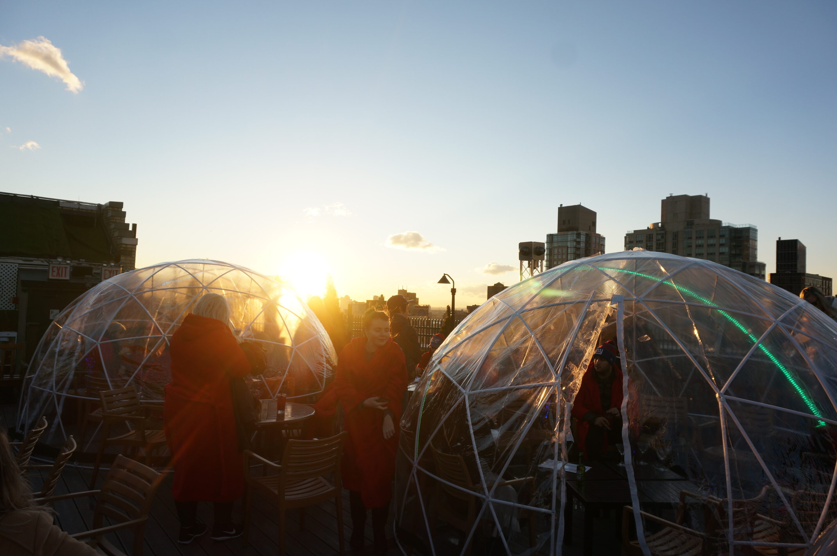Sunset over an igloo on 230 Fifth Rooftop