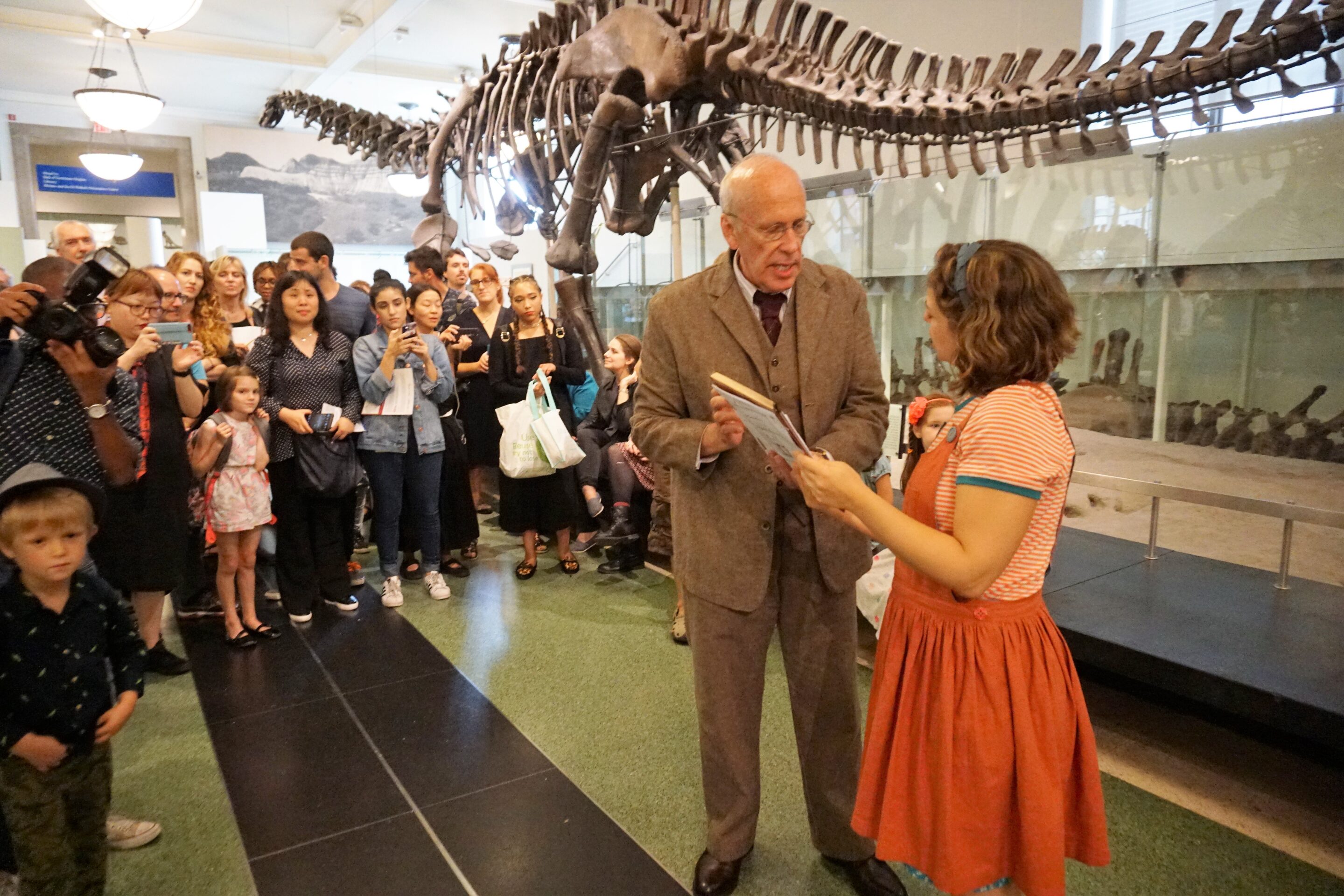 Watching the performance of Rhoda and the Fossil Hunt at the American Museum of Natural History