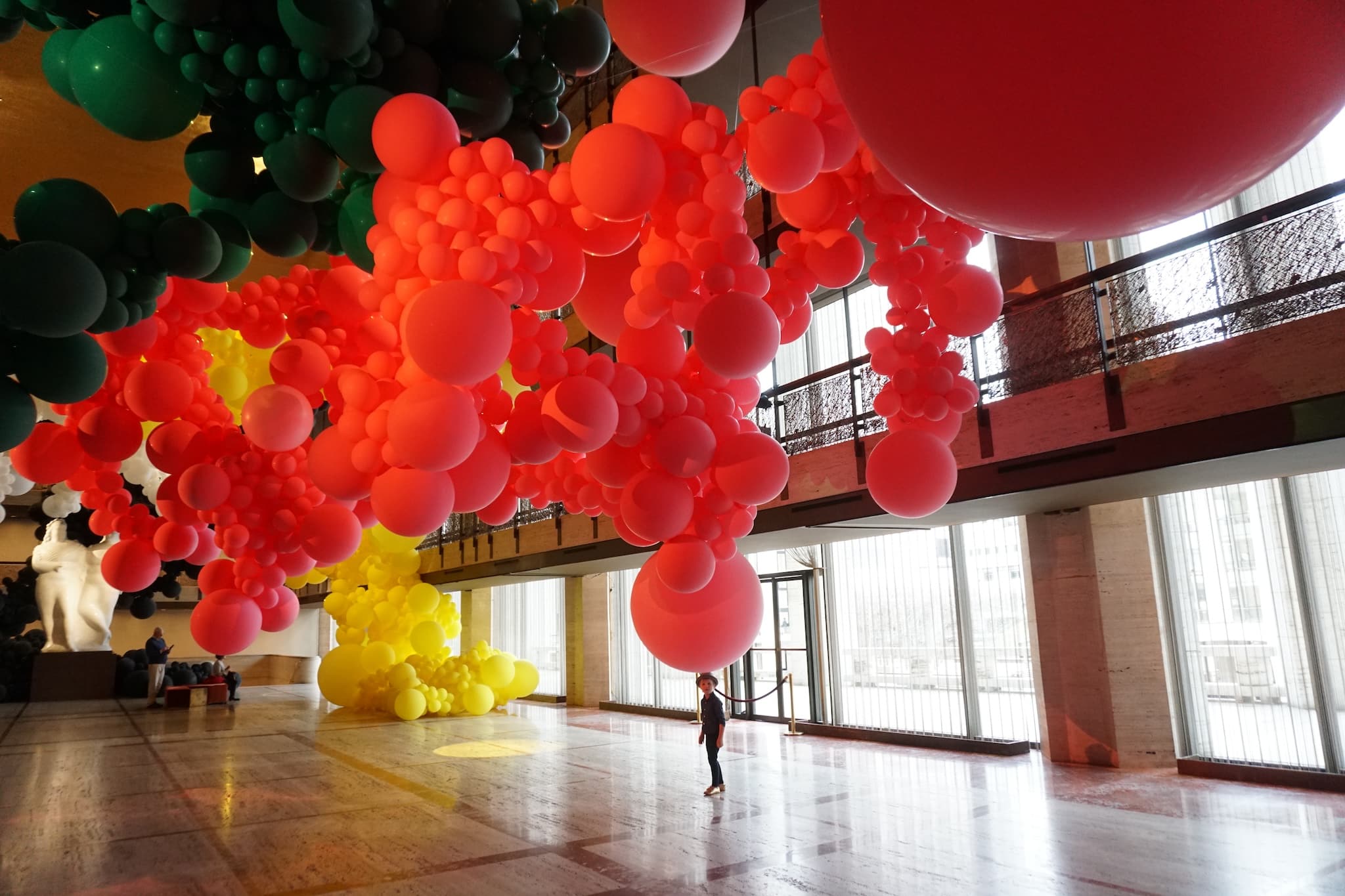 Standing under a balloon at the Geronimo Installation
