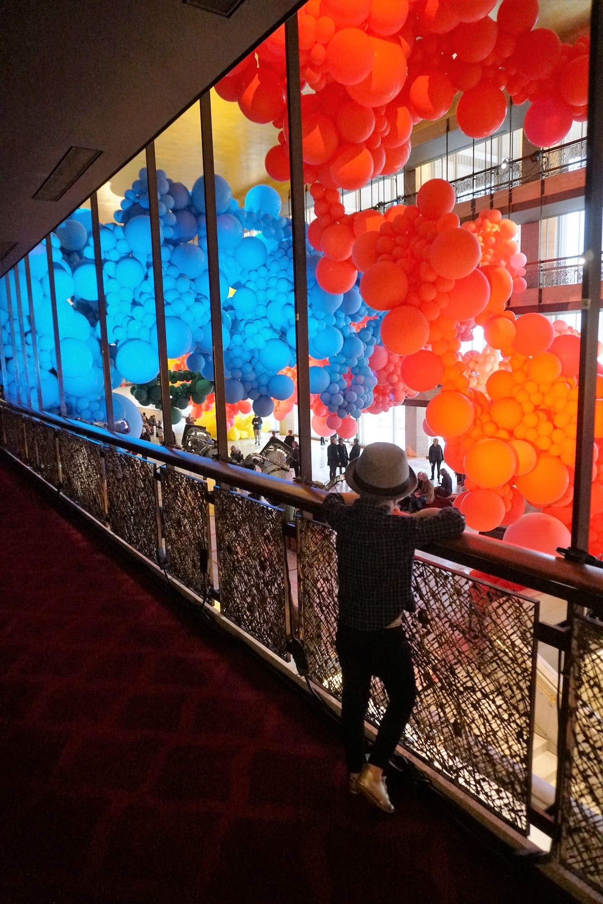 Walking along the balcony at the Geronimo Balloon Installation at NYCB